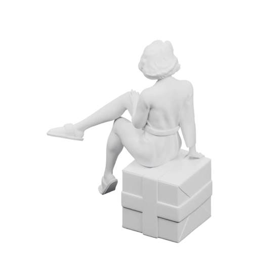 Человек сидит на подарочной коробке