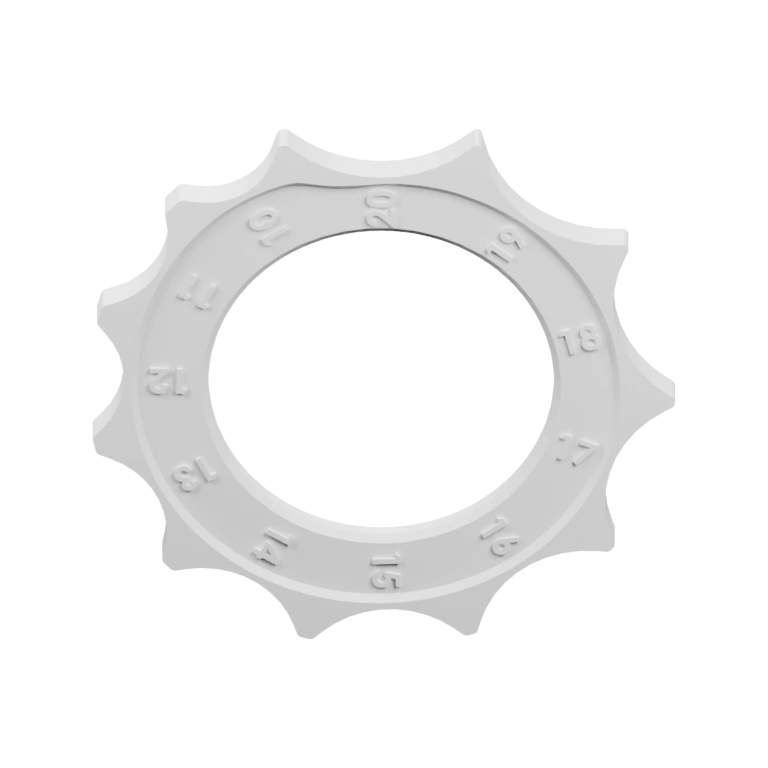 Круглый элемент с зубцами и цифровыми отметками по окружности