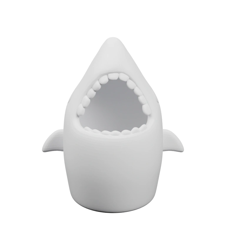 Фигура в форме акулы с открытым ртом и зубами