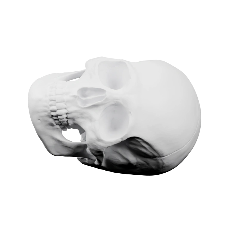 Фигурка с выступающими рогами и отверстием на затылке