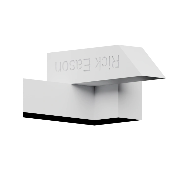 Геометрическая конструкция с вырезами и надписью на боковой поверхности